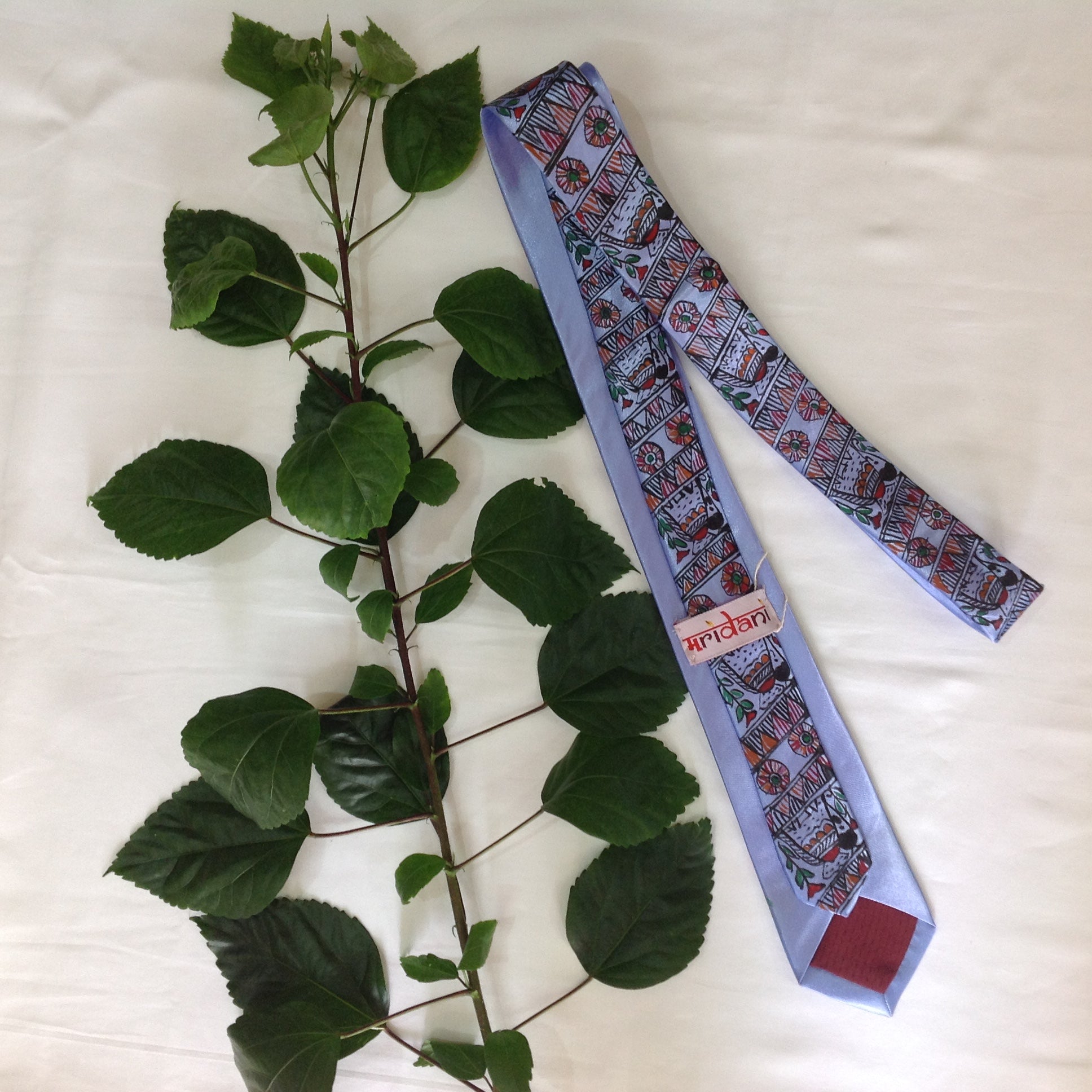 Handpainted Madhubani Silk Tie – Light Blue with Elephant & Floral Motifs